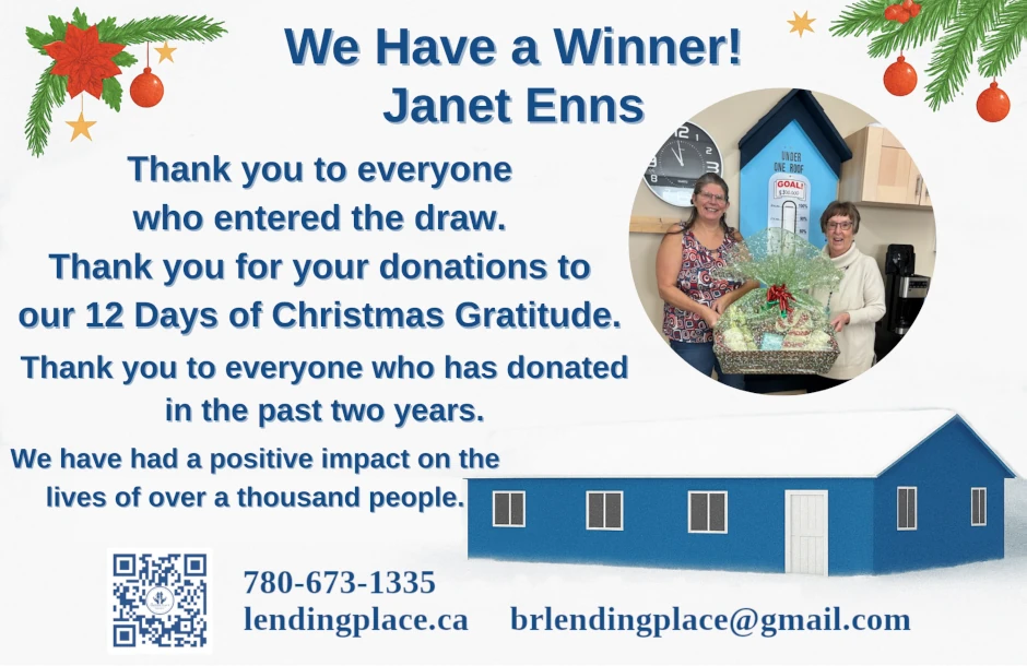 We have a winner, picture of Janet Enns at the battle river lending place Camrose receiving the gift basket that she was drawn for as she collected and decoded the hidden letters 'UNDER ONE ROOF'
